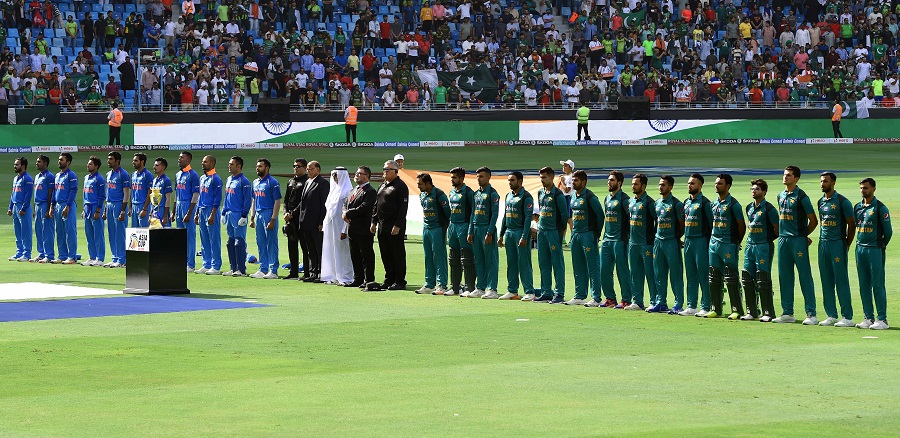 Pakistan and Indian players line up for the national anthem just before the start of the ODI. PHOTO: AFP