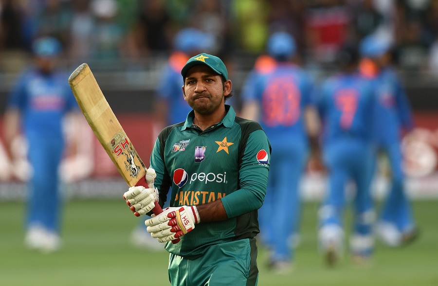 Sarfraz Ahmed leaves the field after being dismissed. PHOTO: AFP