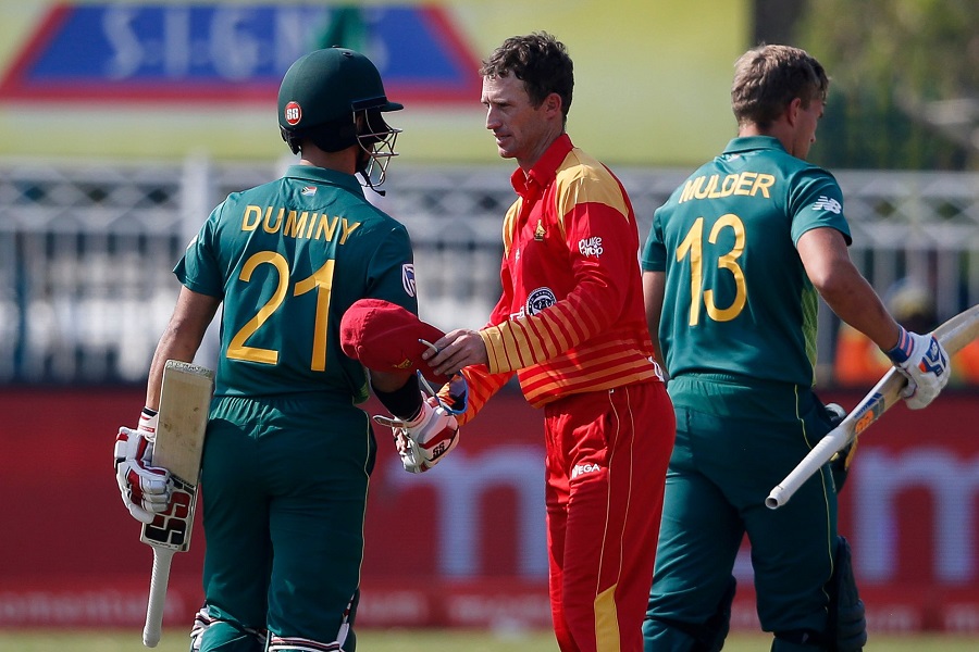 South Africa's captain Jean-Paul Duminy (L) congratulates Zimbabwe's players after his team won the first One Day International cricket match between South Africa and Zimbabwe. PHOTO: AFP