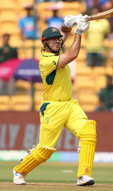 Mitchell Marsh poses after hitting straight six