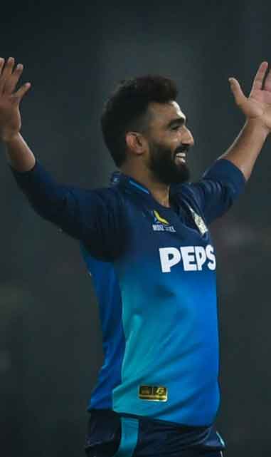 Usama Mir celebrates his first wicket of the match