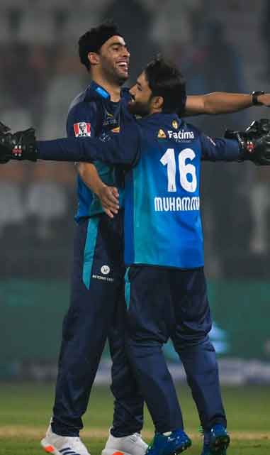 Mohammad Rizwan hugs Abbas after taking wicket