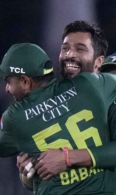Mohammad Amir hugs Babar Azam after claiming his wicket