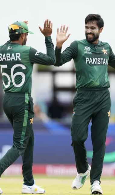 Mohammad Amir celebrates his wicket with Babar Azam