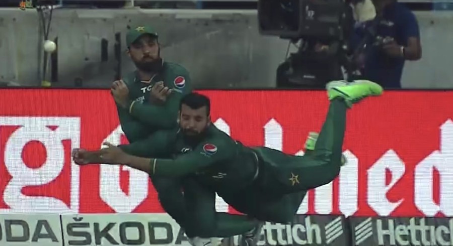 WATCH: Shadab Khan and Asif Ali's comical fielding error goes for a six